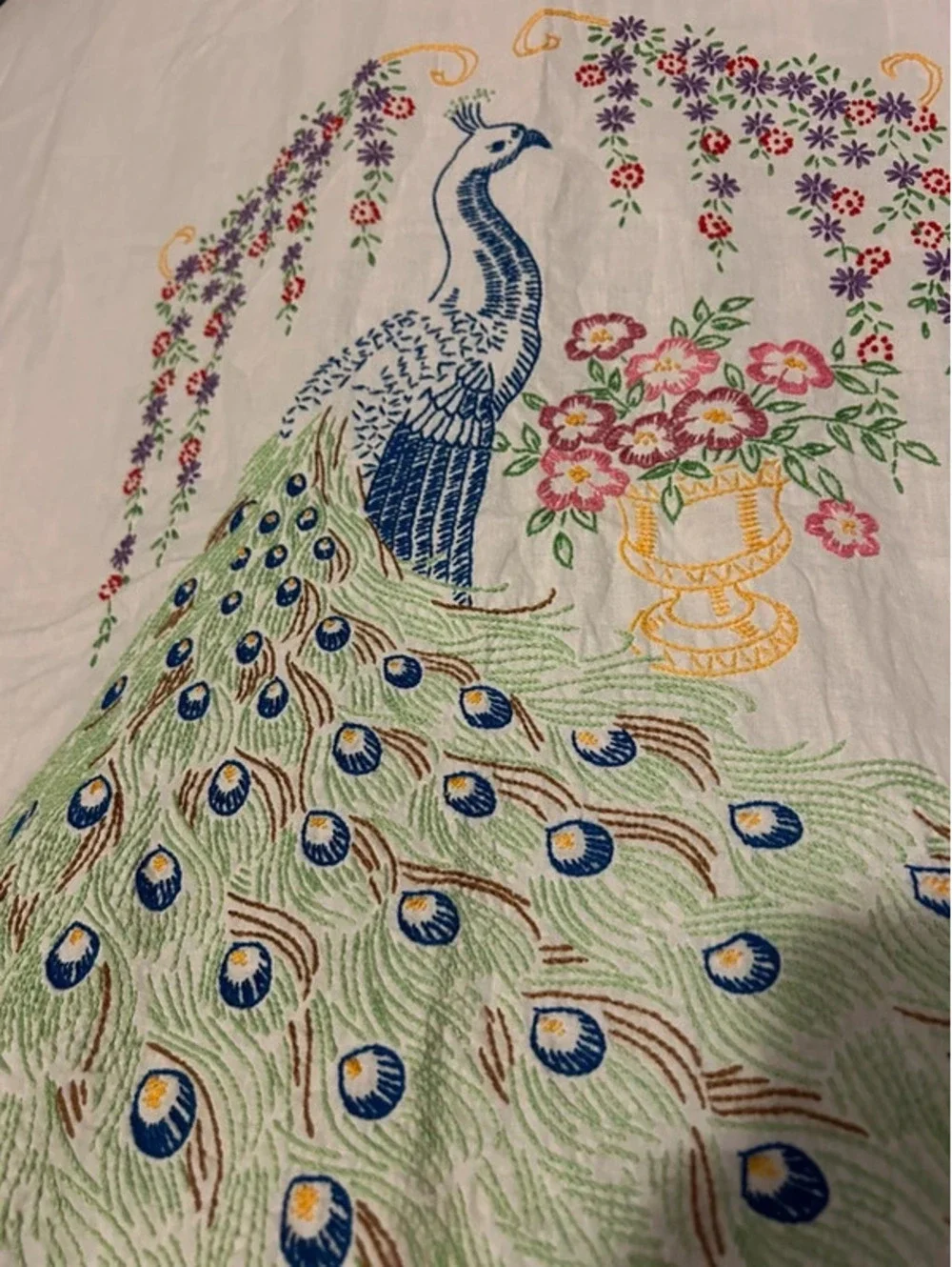 Embroidered peacock linen